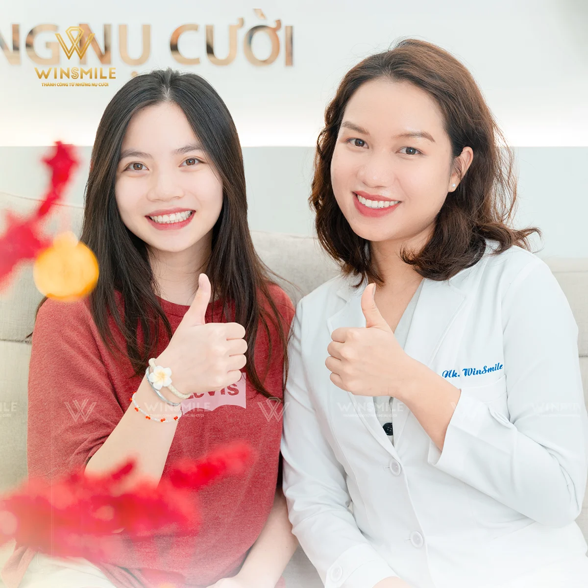 A beaming client alongside Dr. Ha on her braces removal day