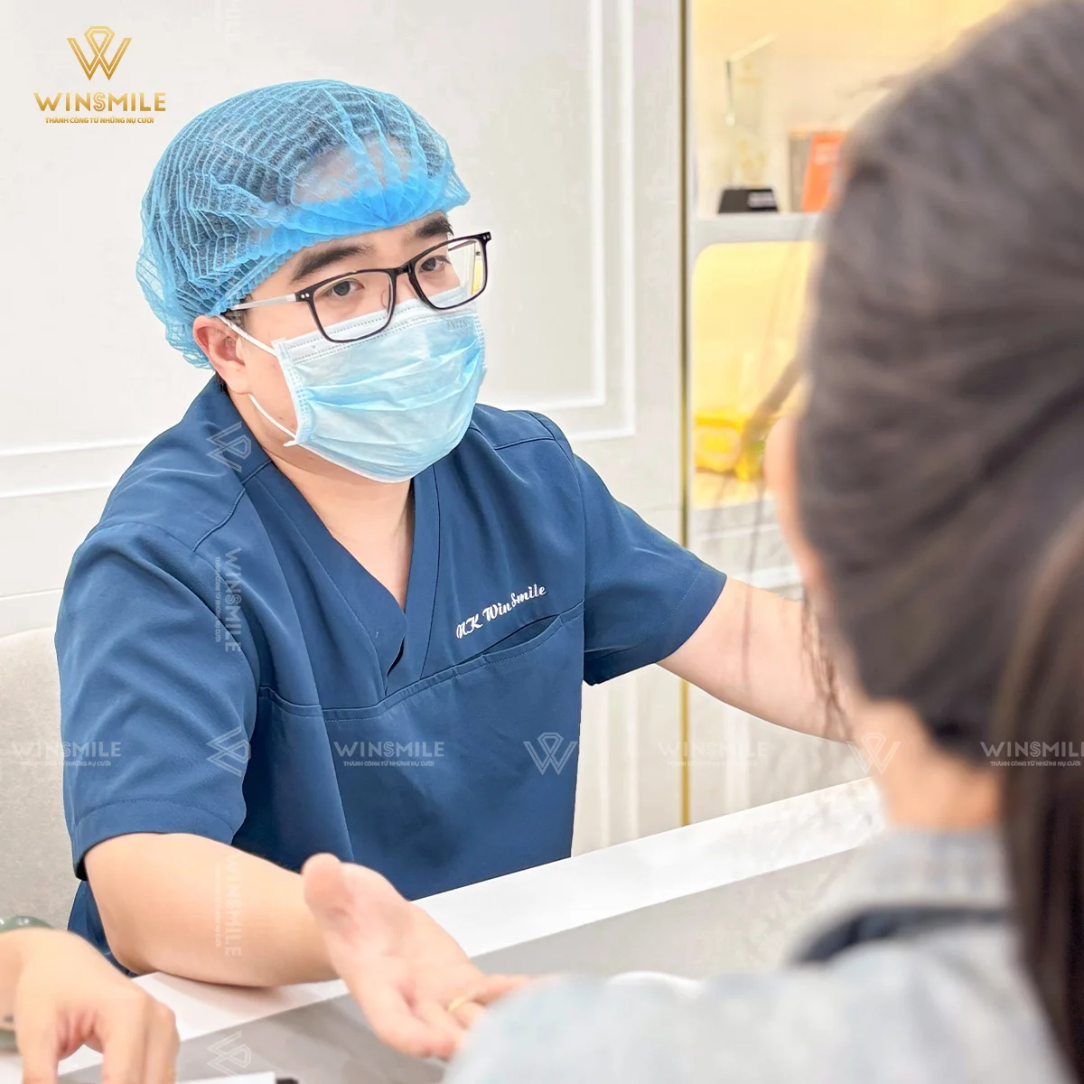 Dr. Phuong dedicatedly guiding a client through their consultation